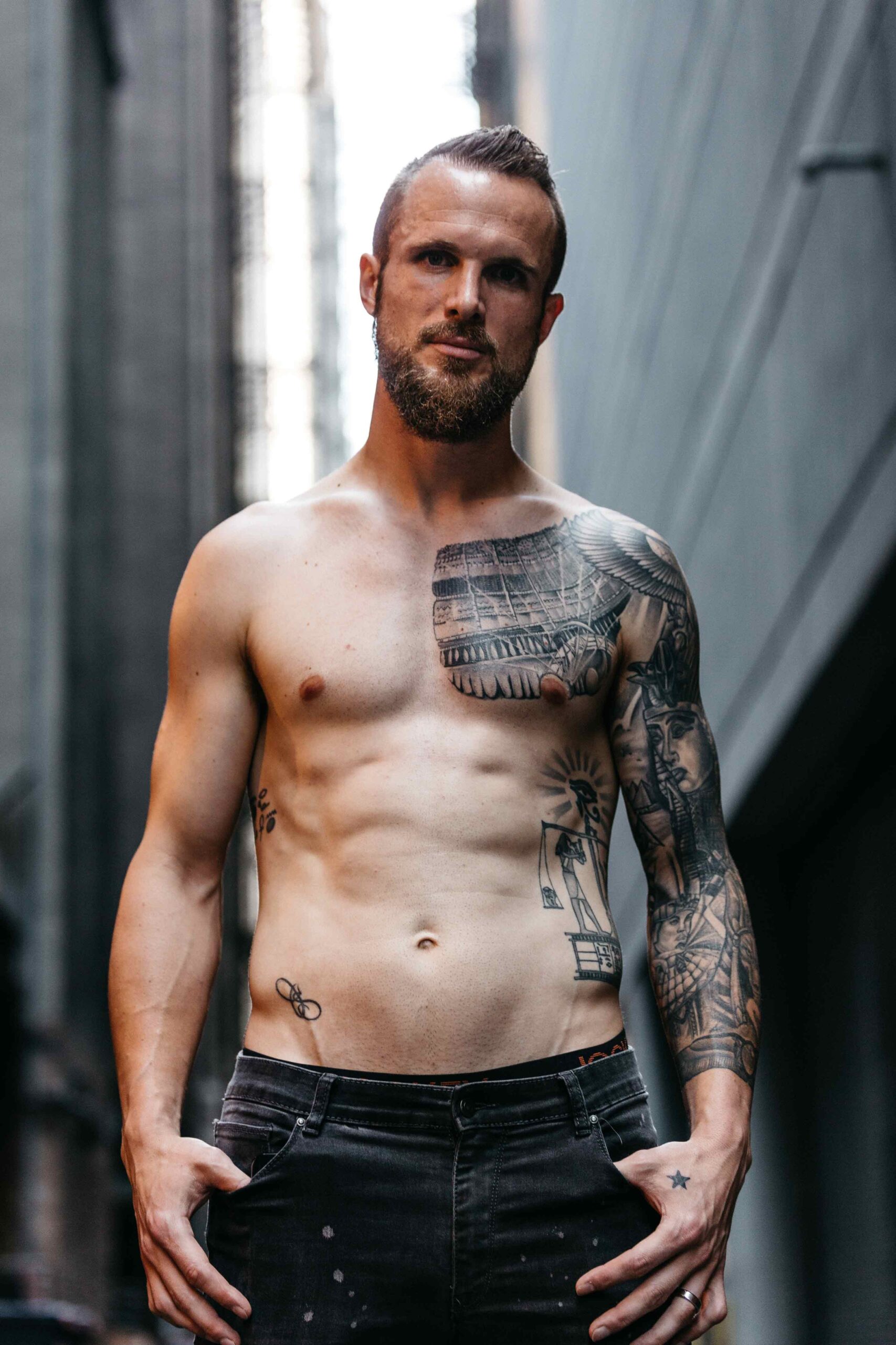 Stefan Frei tattoos: full-front view of the Book of the Dead torso scene and connected Egyptian sleeve