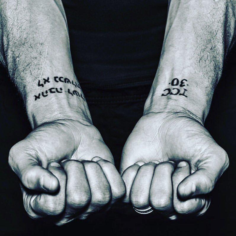 Stephen Curry tattoos: TCC 30 and Hebrew wrist lettering close-up