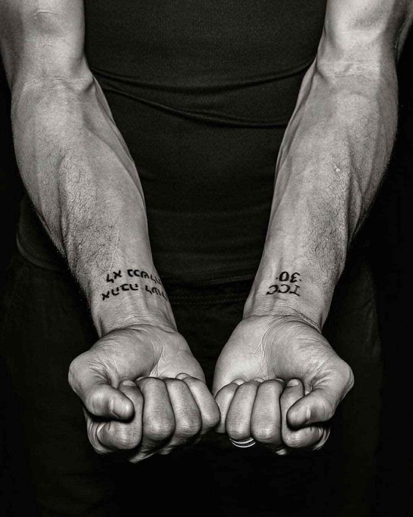 Stephen Curry tattoos: close-up of the TCC 30 and Trust wrist lettering