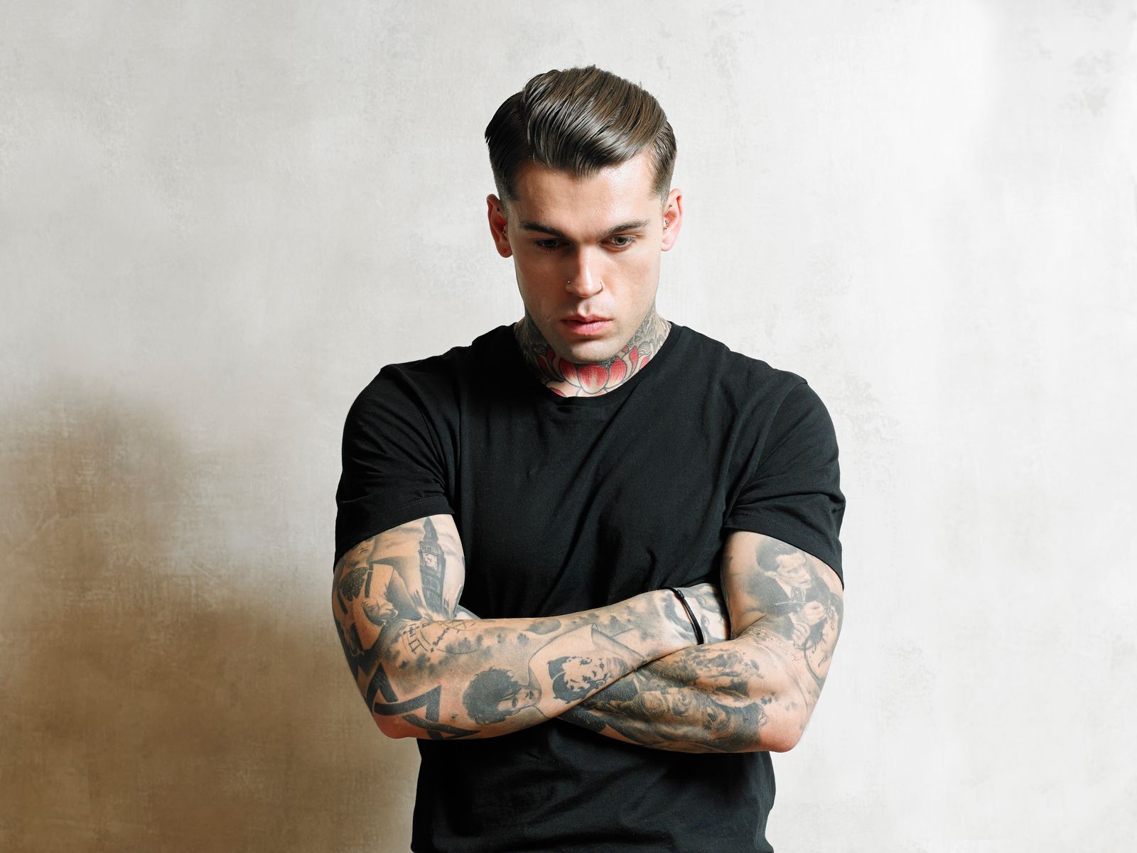 Stephen James tattoos: British portrait sleeve and contrasting Dali-inspired arm