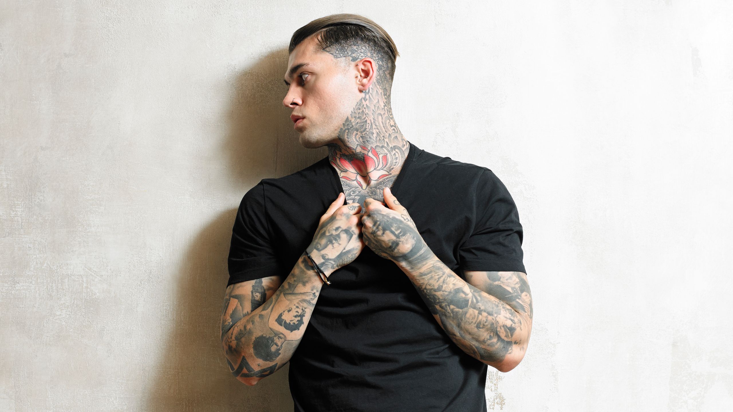 Stephen James tattoos: Red lotus petals and repeating side-neck ornament