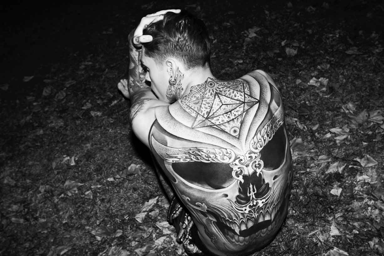 Stephen James tattoos: Large back skull eye sockets, teeth and upper-back geometry