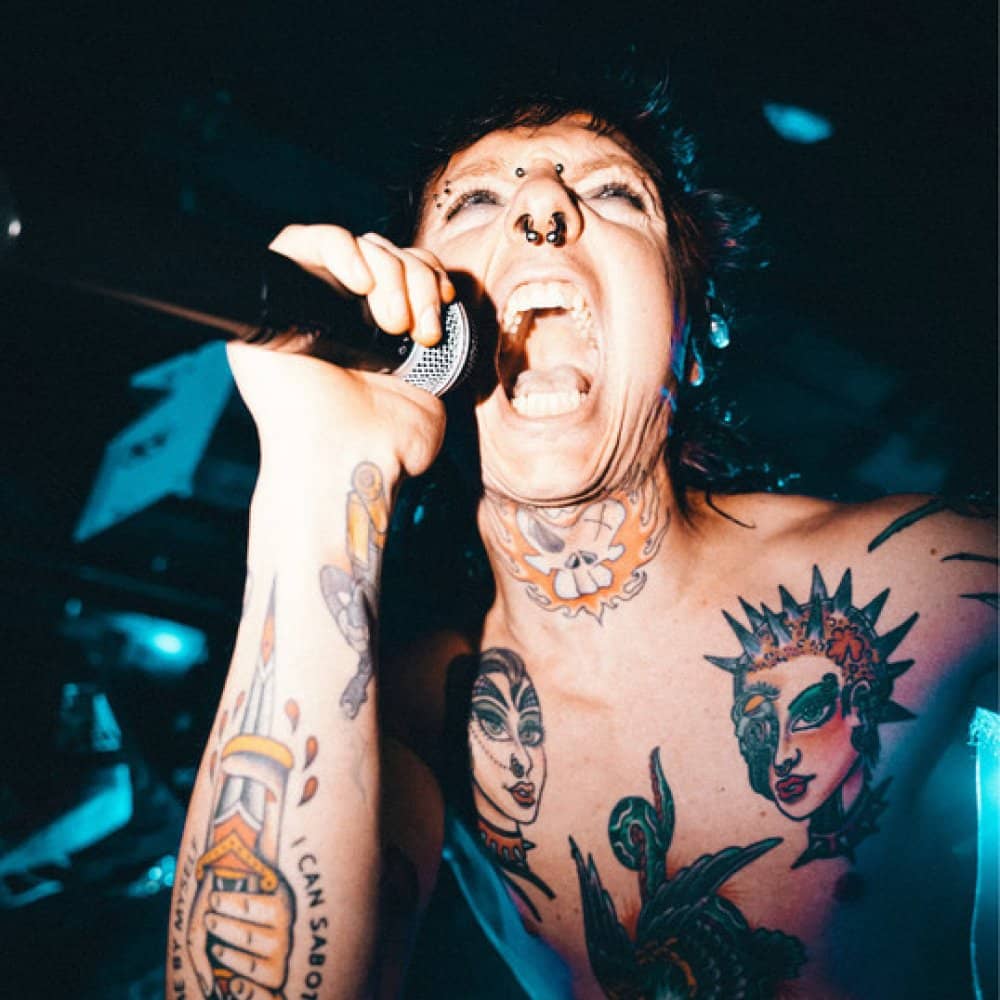 Sueco chest and arm tattoos