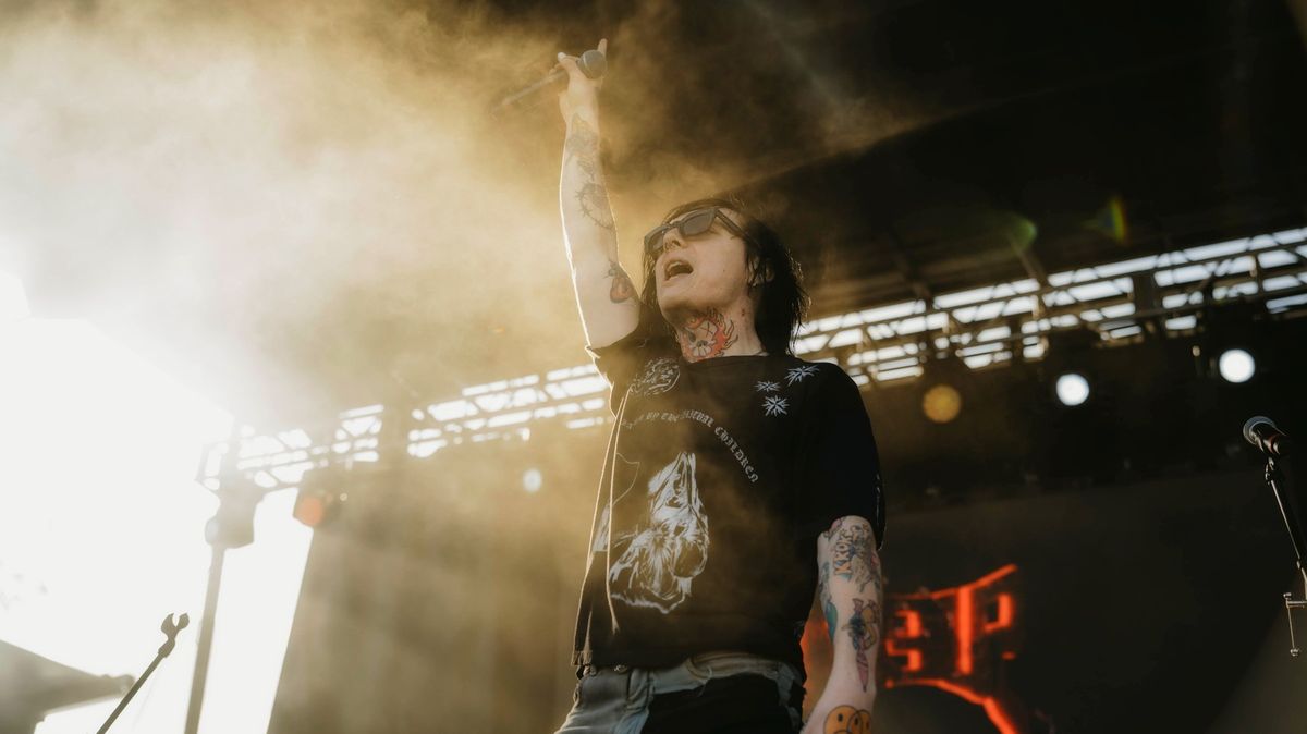 Sueco arm tattoos on stage