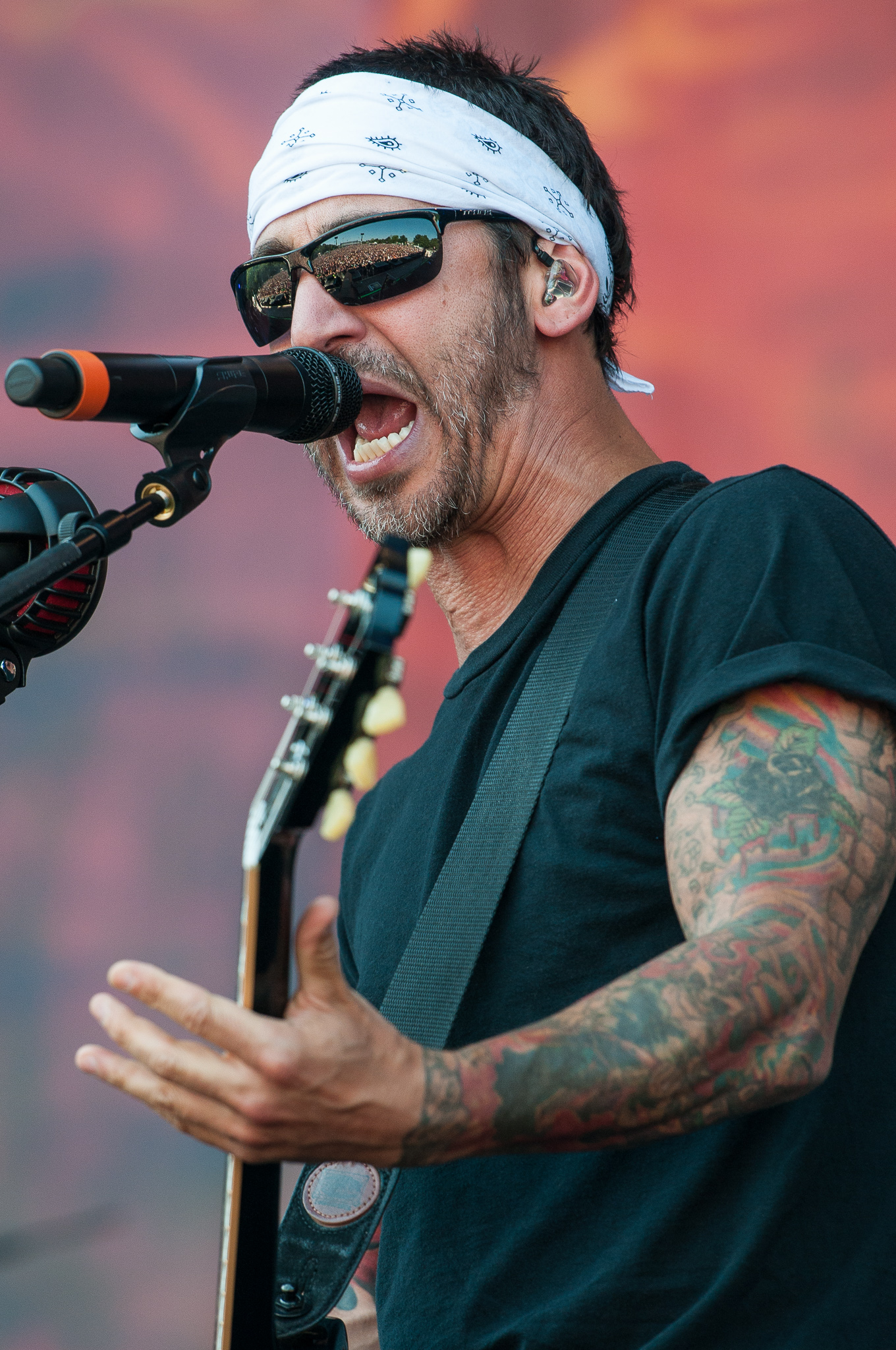 Close view of Sully Erna colorful arm tattoos