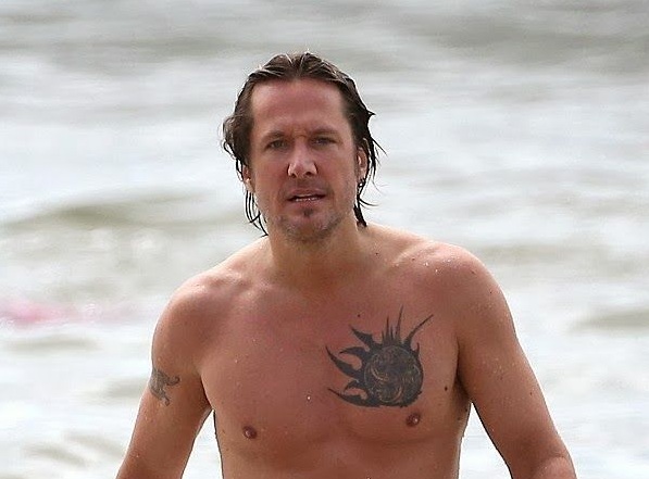 Keith Urban tribal sun chest tattoo