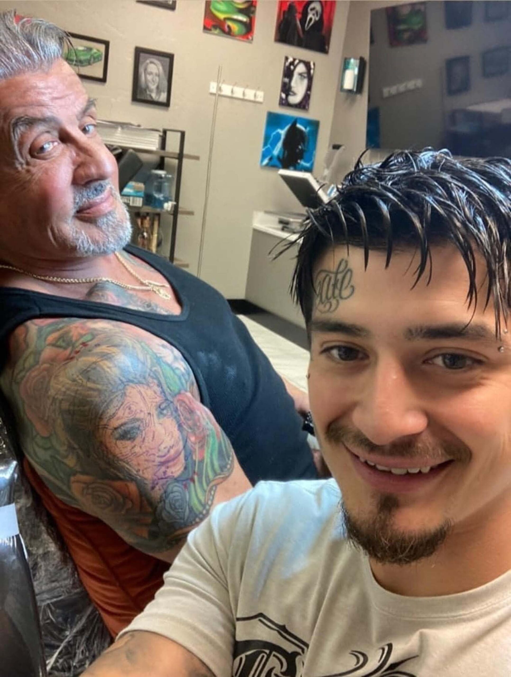 Sylvester Stallone colourful shoulder tattoos