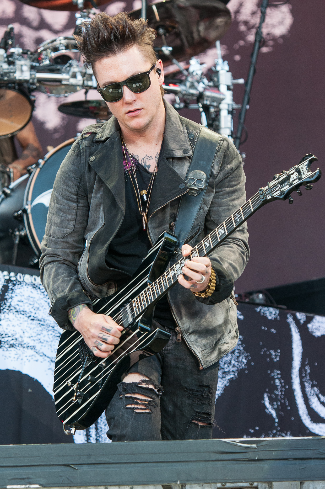 Synyster Gates chest tattoo stage
