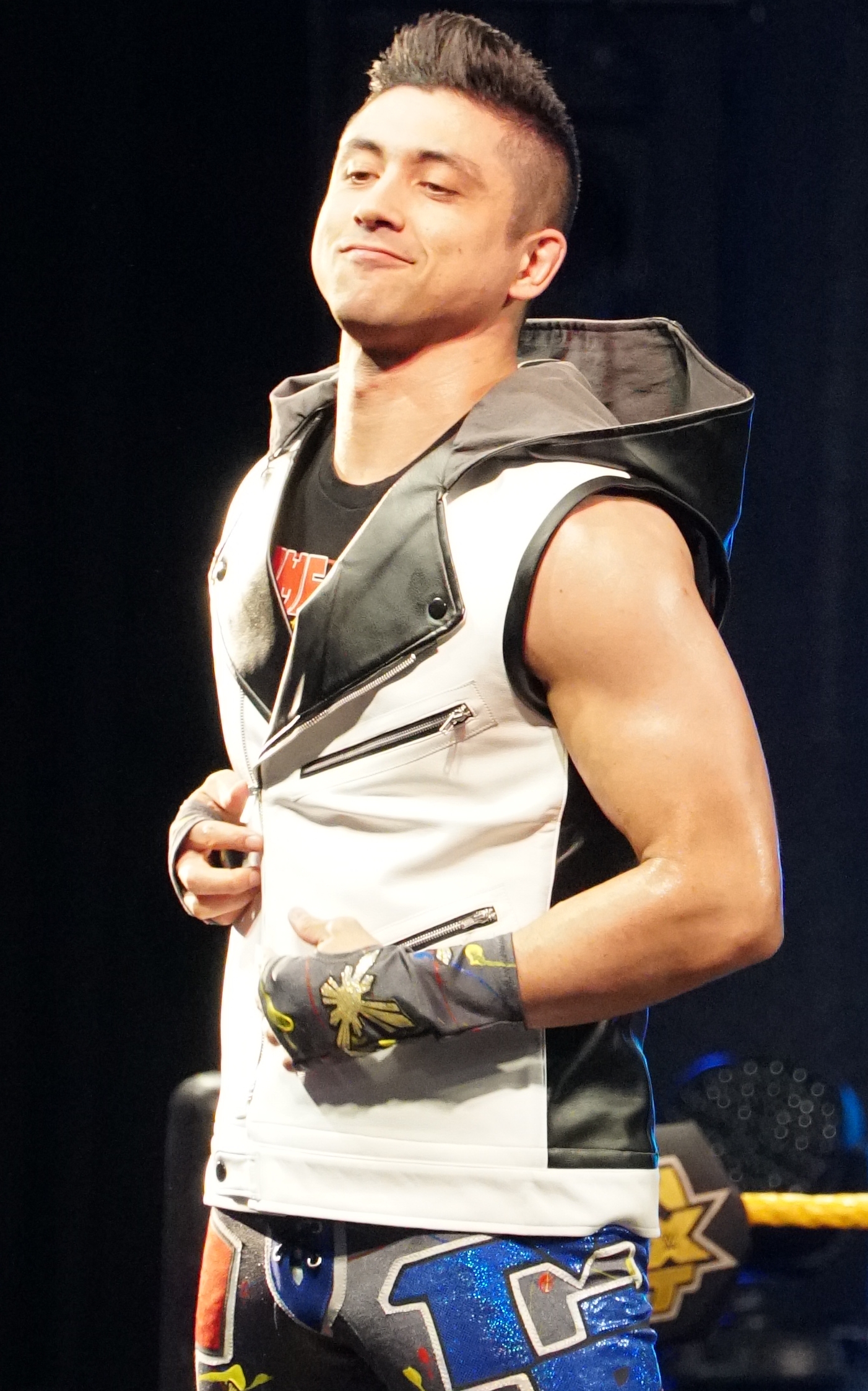 T.J. Perkins in a contextual photograph: contextual event photograph; not tattoo evidence; not tattoo evidence