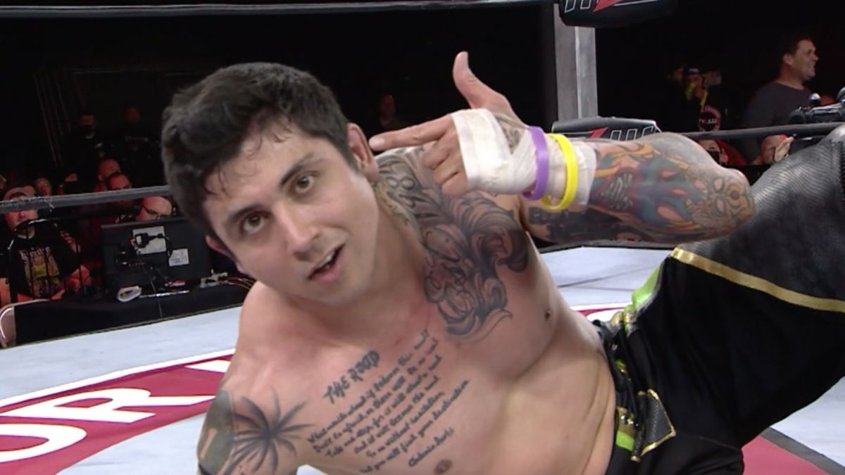 T.J. Perkins tattoos: second genuine view of the chest script and colorful sleeves
