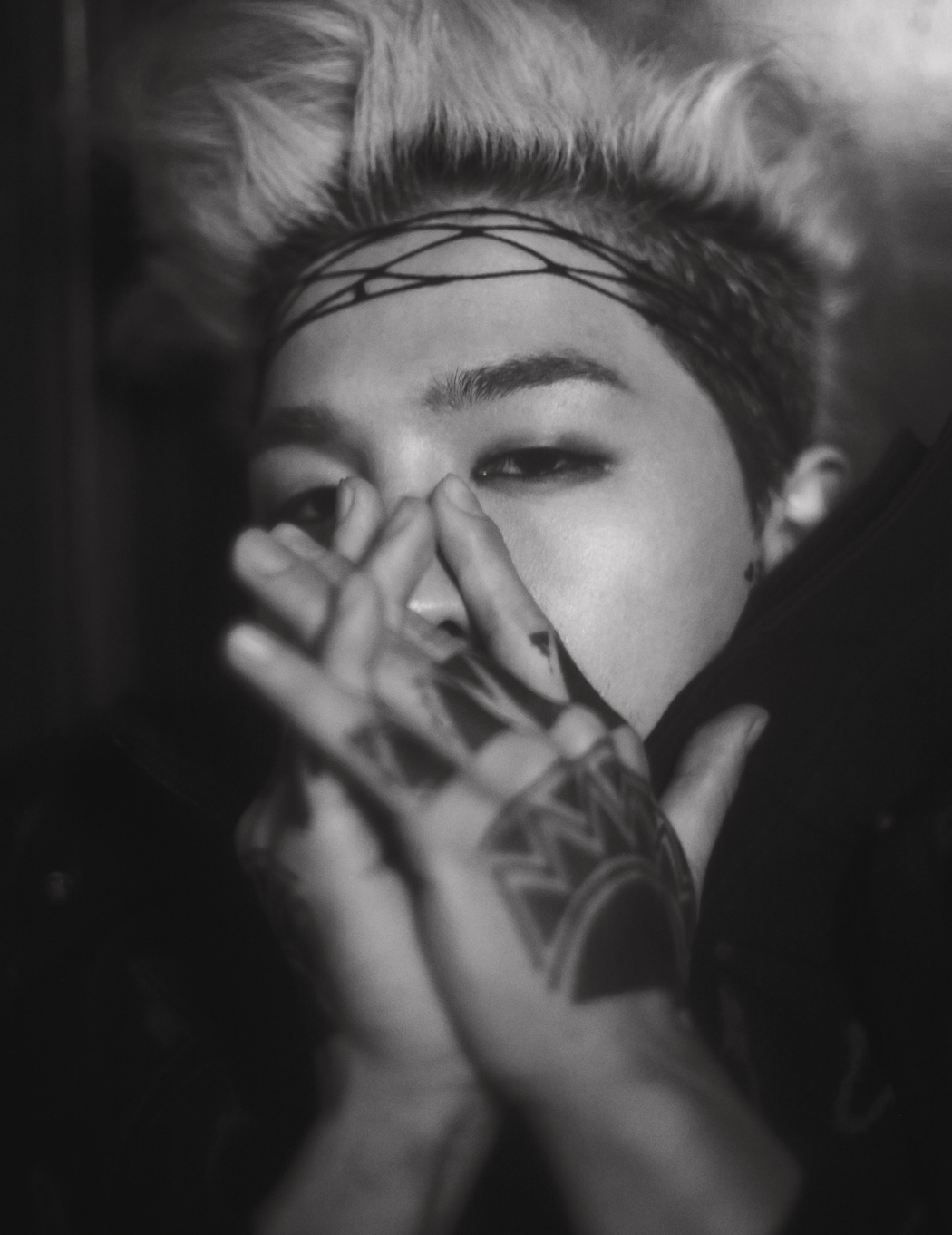 Taeyang tattoos: face-level hand tattoo detail