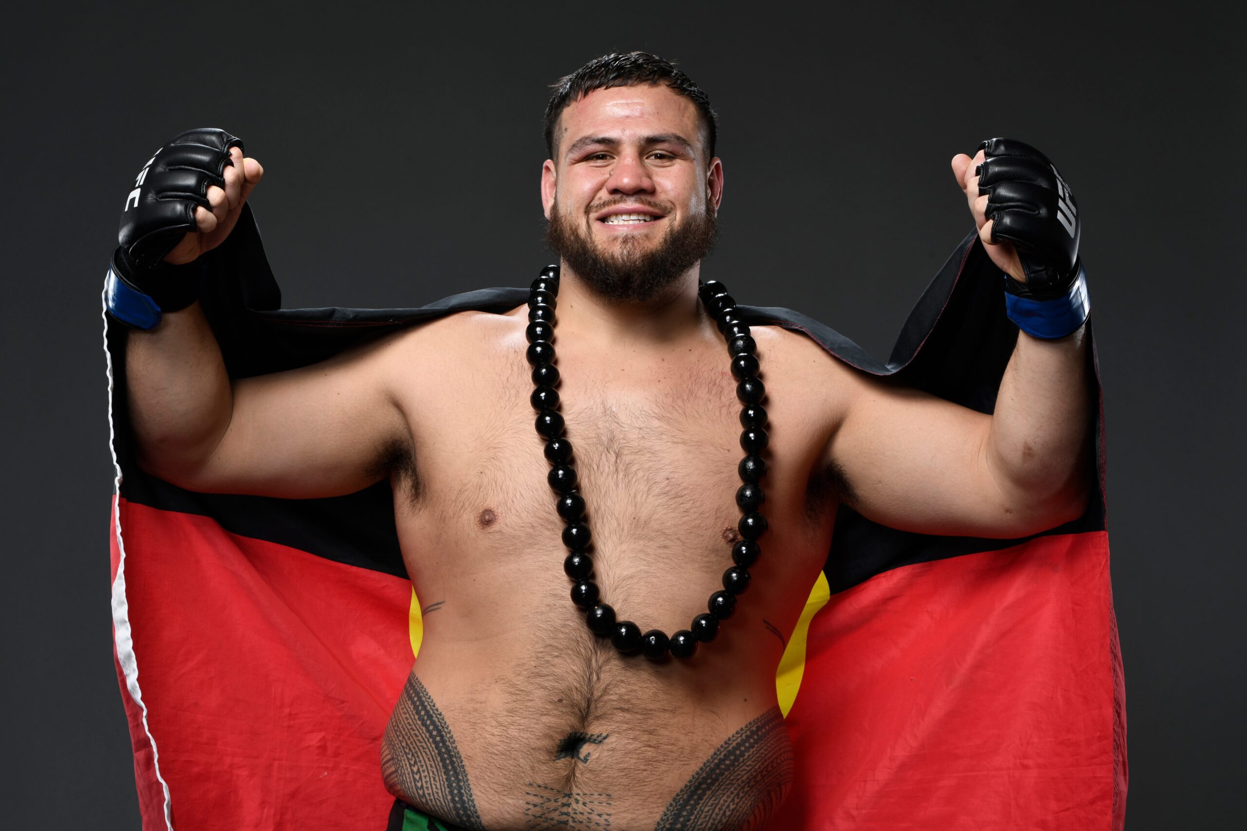 Tai Tuivasa tattoos: lower back and hip pe’a pattern