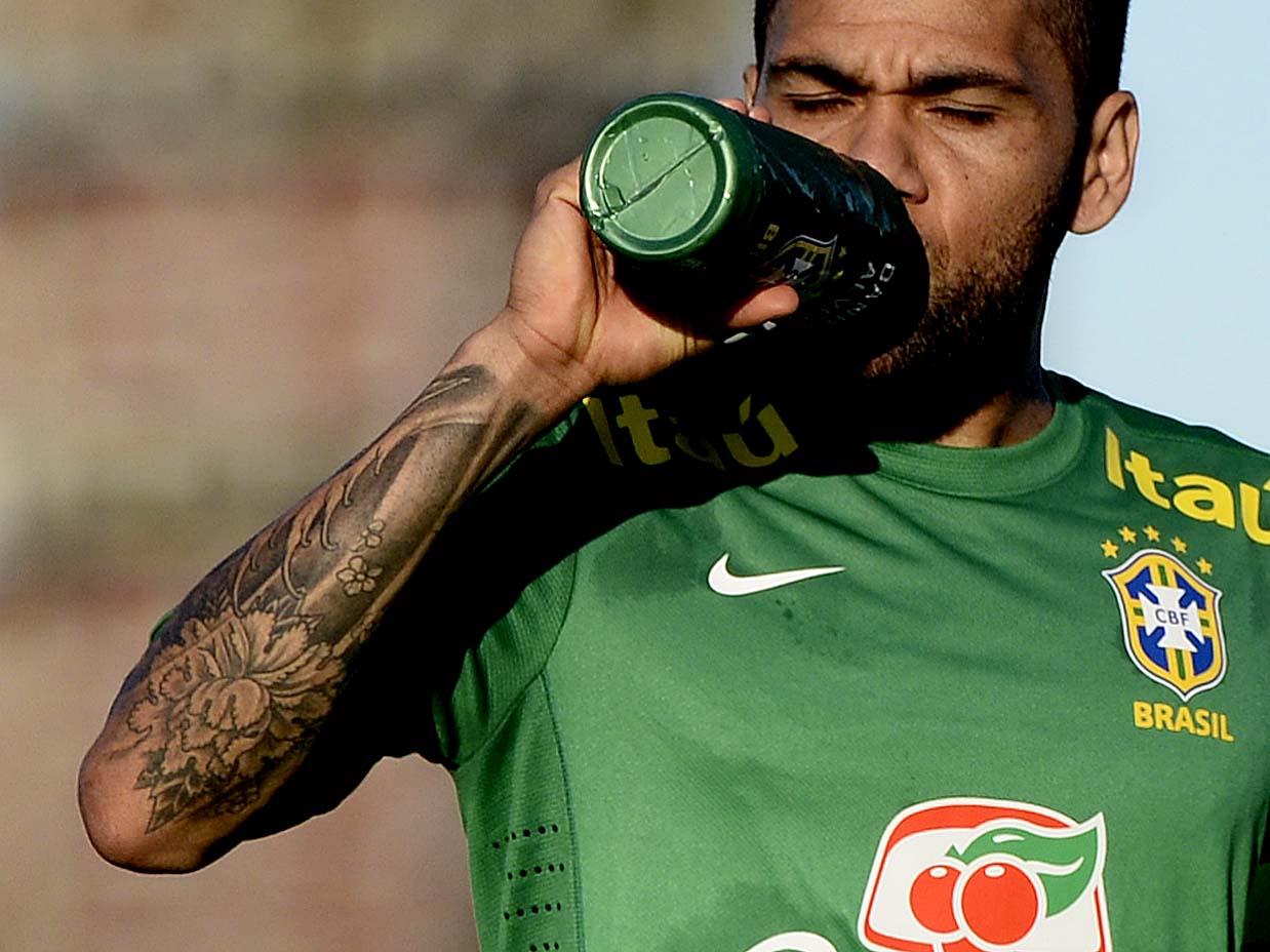 Dani Alves tattoos: separate close image showing the opposite arm, Japanese-inspired shapes and compact marks around the forearm