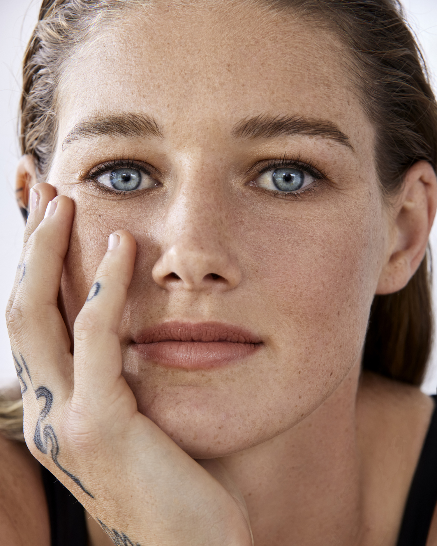 Tayla Harris tattoos: tattooed hand and forearm in a beauty portrait