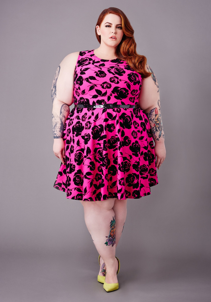 Tess Holliday Distinct full-length studio photograph with calf and arm tattoos visible Tess Holliday tattoos: Distinct full-length studio photograph with calf and arm tattoos visible