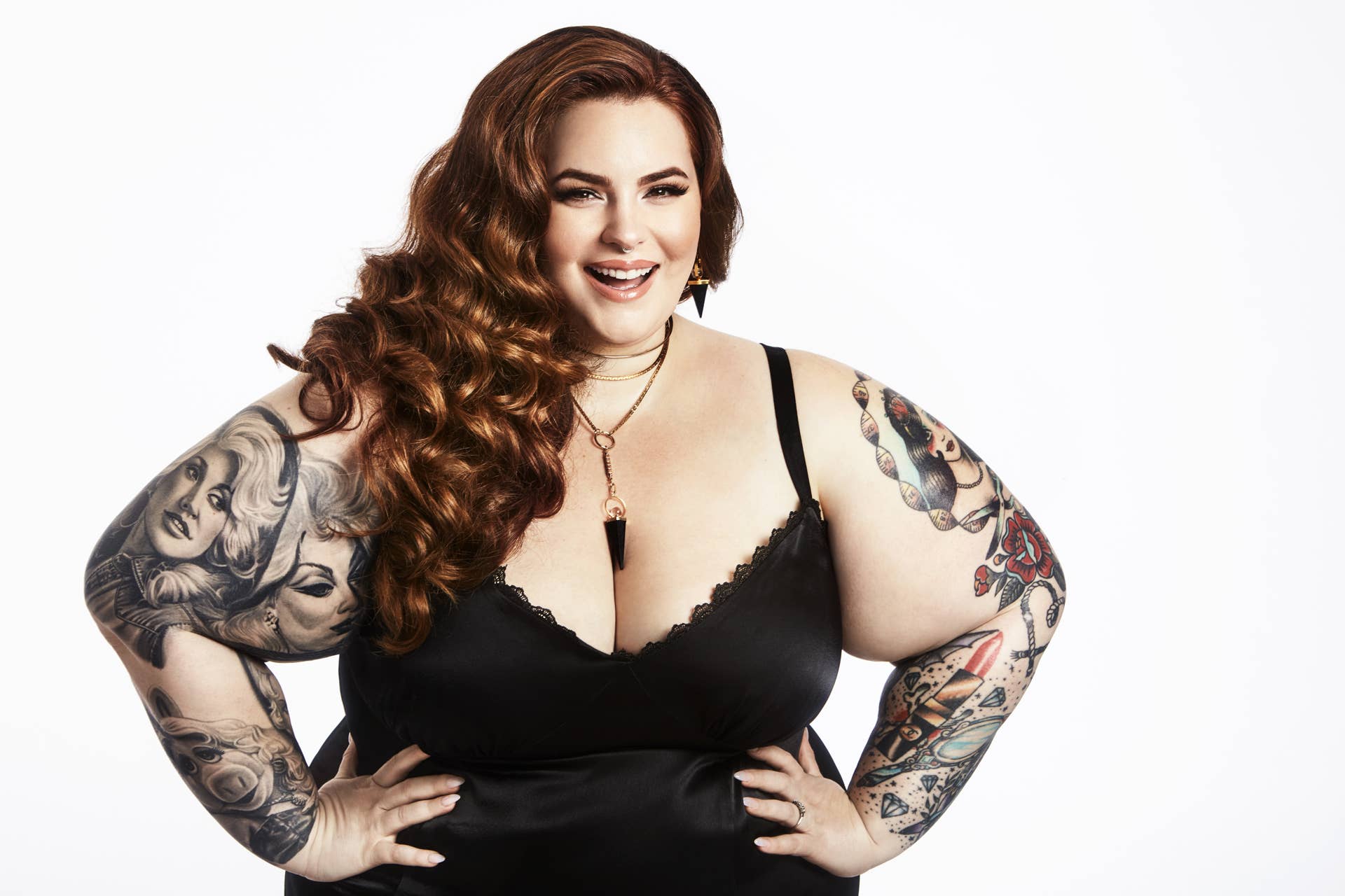 Tess Holliday Wide studio photograph showing both arms and multiple portrait and illustrative tattoos Tess Holliday tattoos: Wide studio photograph showing both arms and multiple portrait and illustrative tattoos