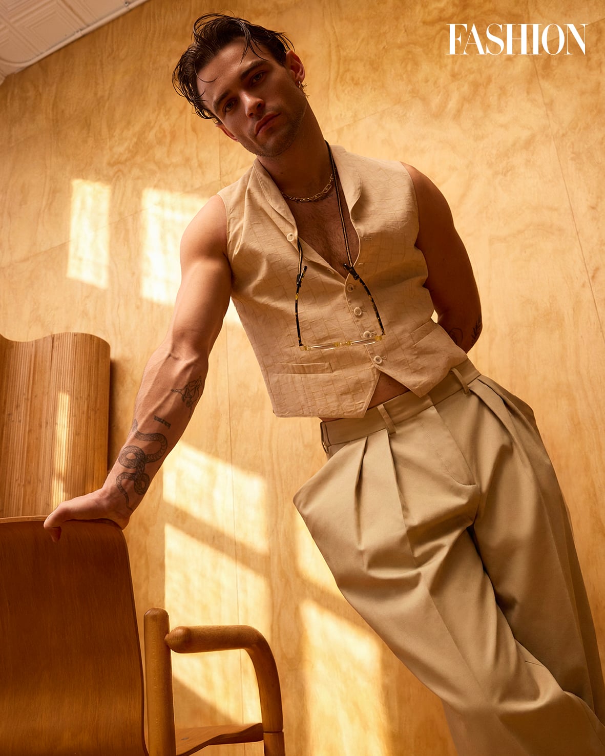 Thomas Doherty tattoos: Thomas Doherty editorial portrait with the arm collection exposed