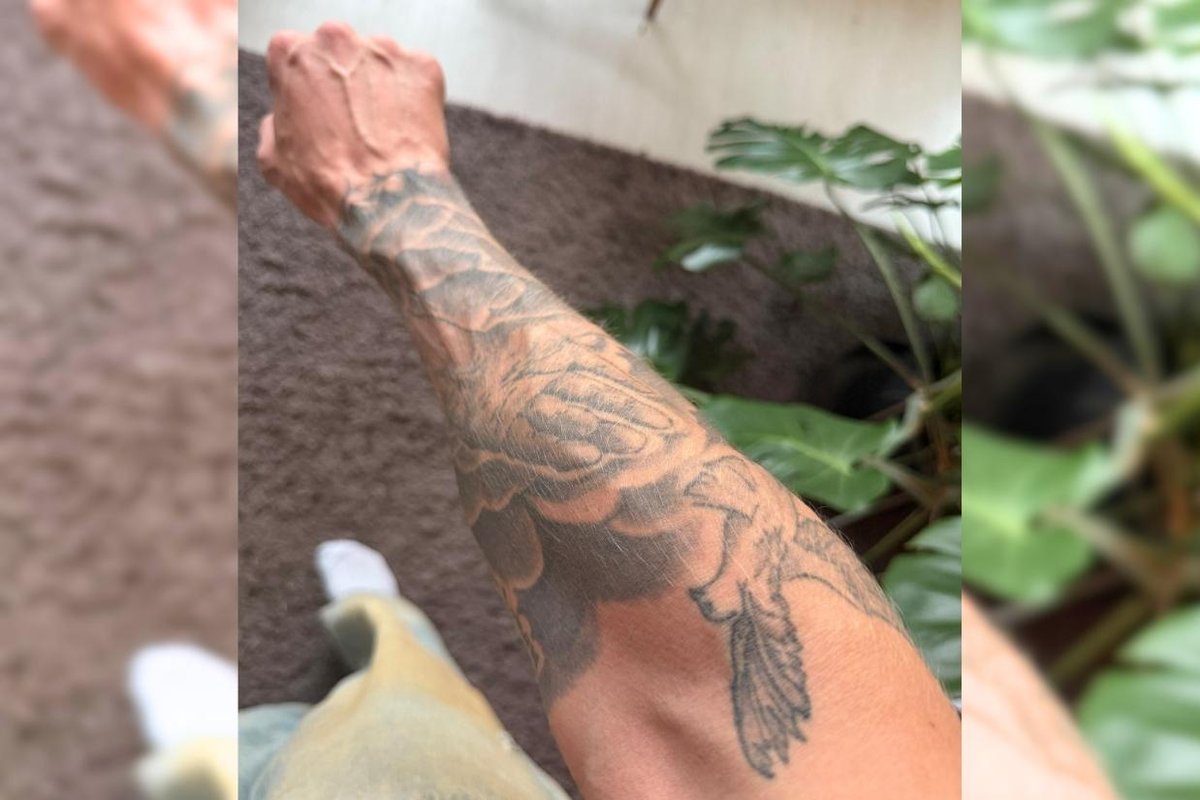 Tim Dolle God's hand and peace dove imagery on the right forearm Tim Dolle tattoos: God's hand and peace dove imagery on the right forearm