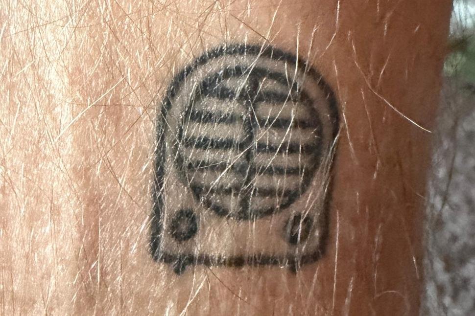 Tim Dolle Small heater tattoo above the right ankle Tim Dolle tattoos: Small heater tattoo above the right ankle