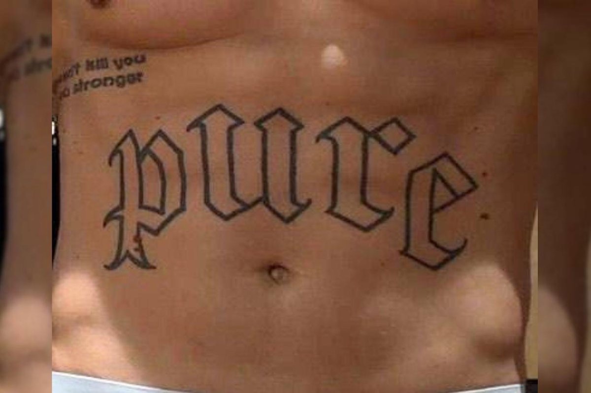 Tim Dolle Pure lettering tattoo across the abdomen Tim Dolle tattoos: Pure lettering tattoo across the abdomen