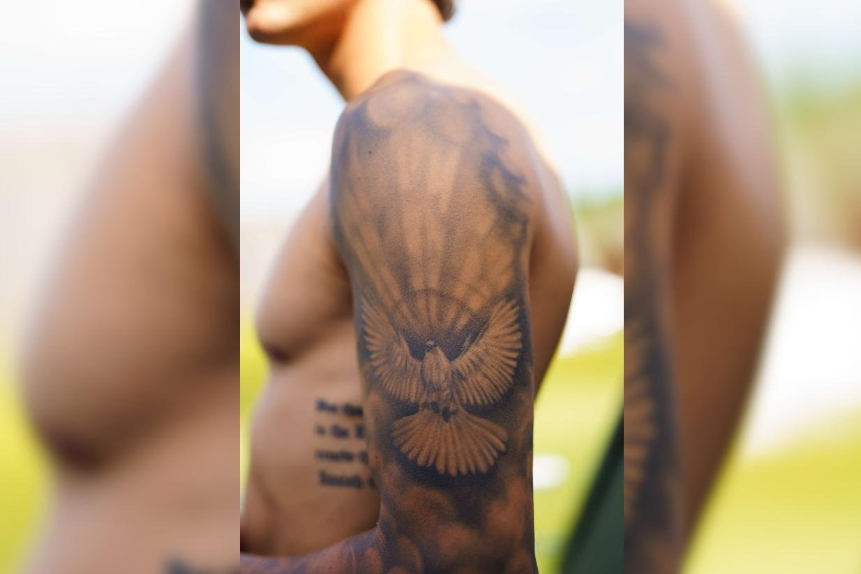 Tim Kühnel tattoos: Close-up documenting the dove that Kühnel identifies with the Holy Spirit