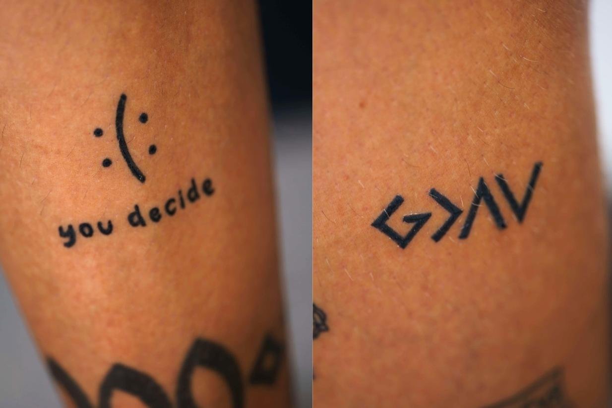 Tim Kühnel tattoos: Photograph documenting Kühnel’s faith-related lettering and adjacent arm tattoos