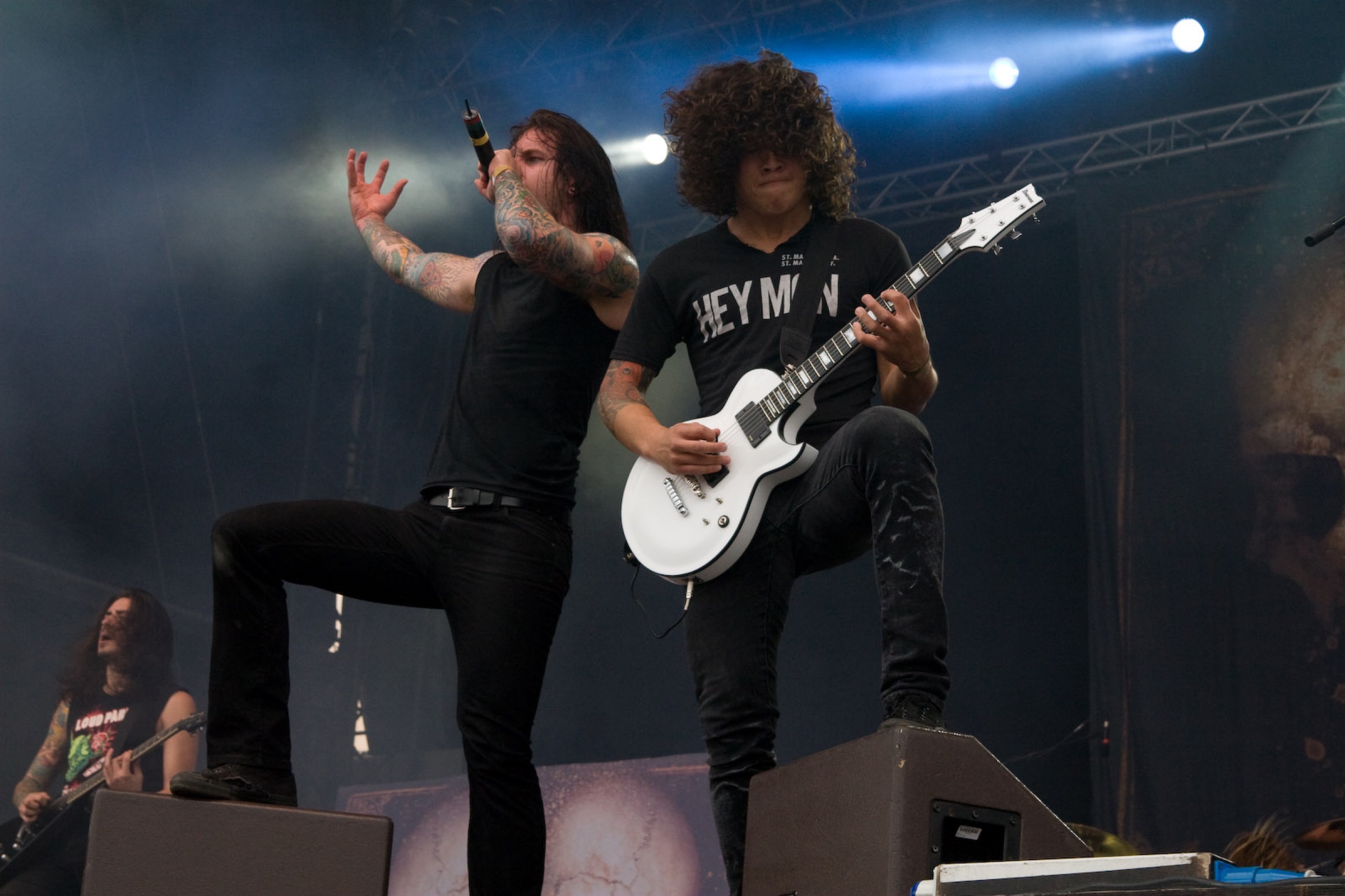 Tim Lambesis performing with both colorful tattoo sleeves visible