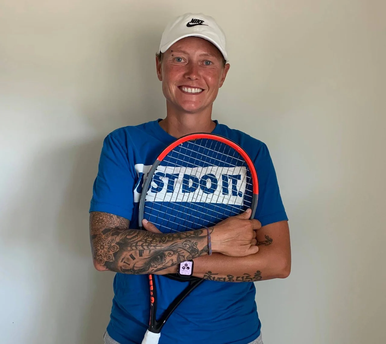 Tina Pisnik tattoos: full arm sleeve and visible leg tattoos in a face-visible sports portrait