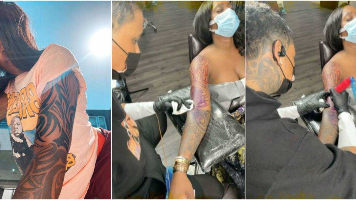Tiwa Savage tattoos: Genuine published tattoo-session photograph showing the artist working on Tiwa Savage’s arm.