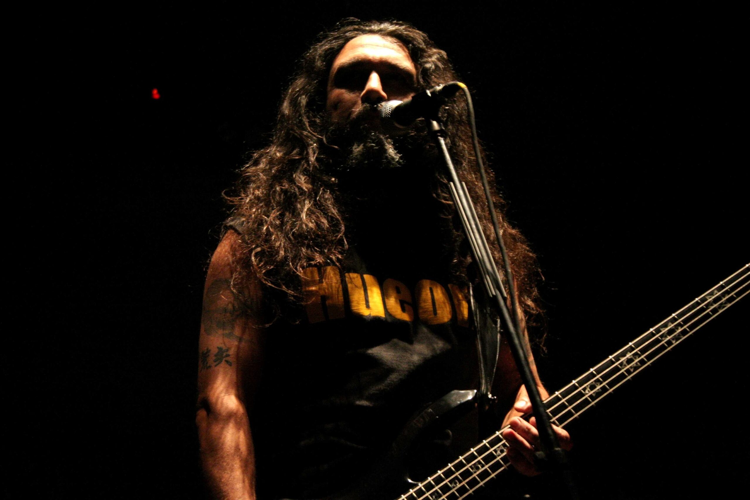 Tom Araya tattooed arms during a 2006 live performance