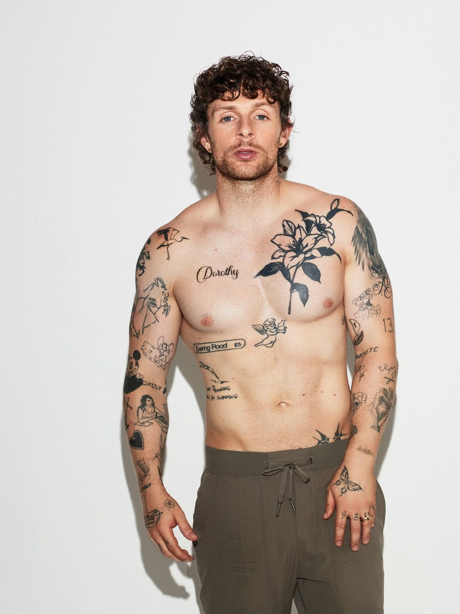 Tom Grennan tattoos: left forearm and hand ink