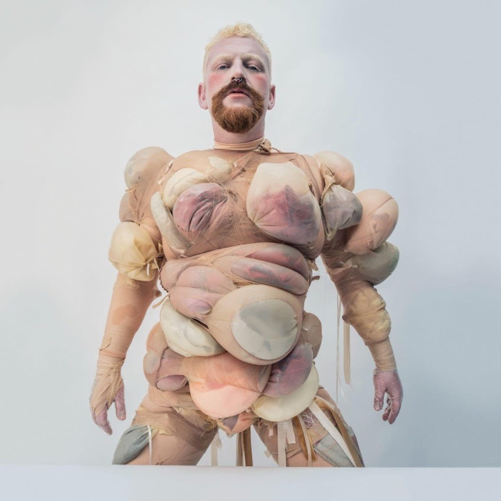 Tom Rasmussen sculptural portrait Tom Rasmussen in a contextual photograph: inline; not tattoo evidence