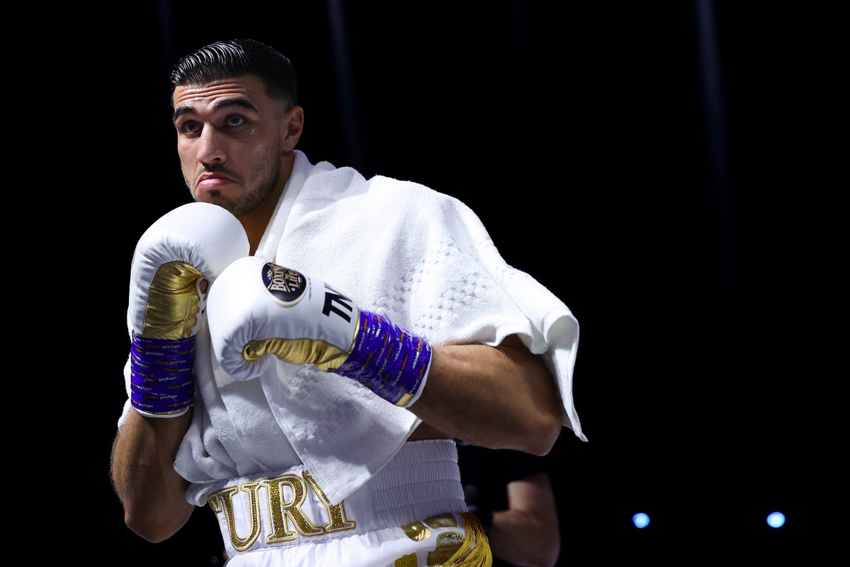 Tommy Fury in a contextual photograph: Contextual ring-walk image; not tattoo evidence.; not tattoo evidence