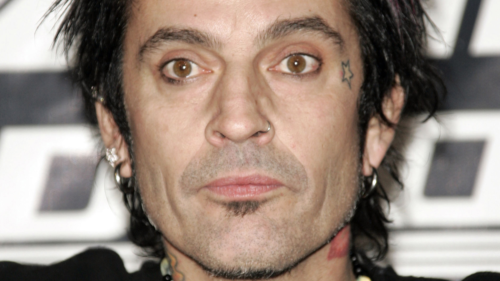 Tommy Lee face and hand tattoos