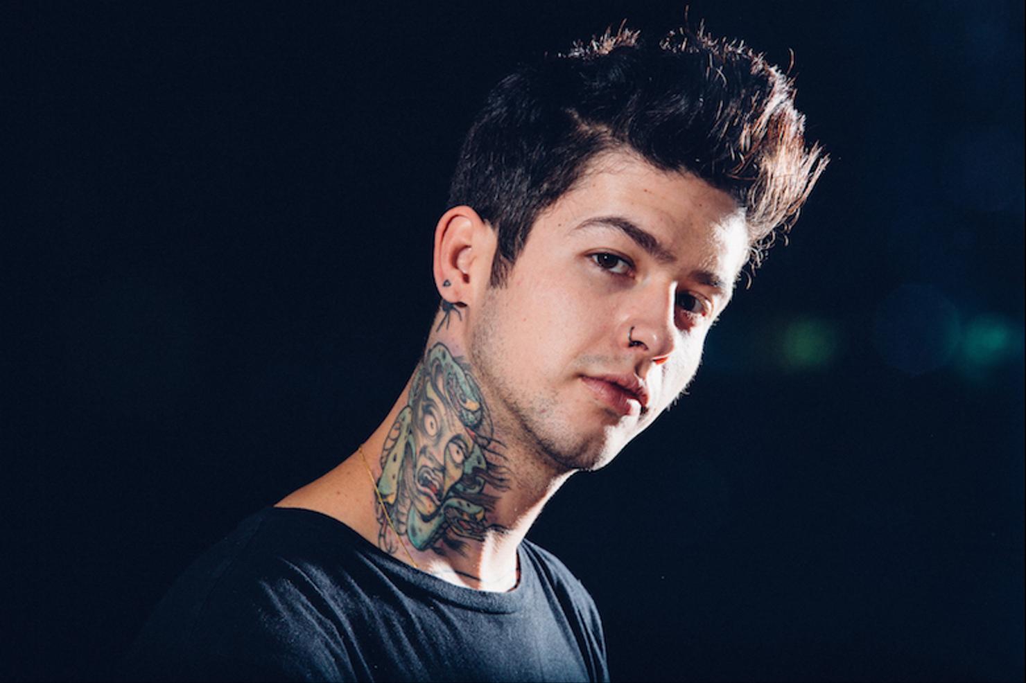 Travis Mills green Medusa neck tattoo