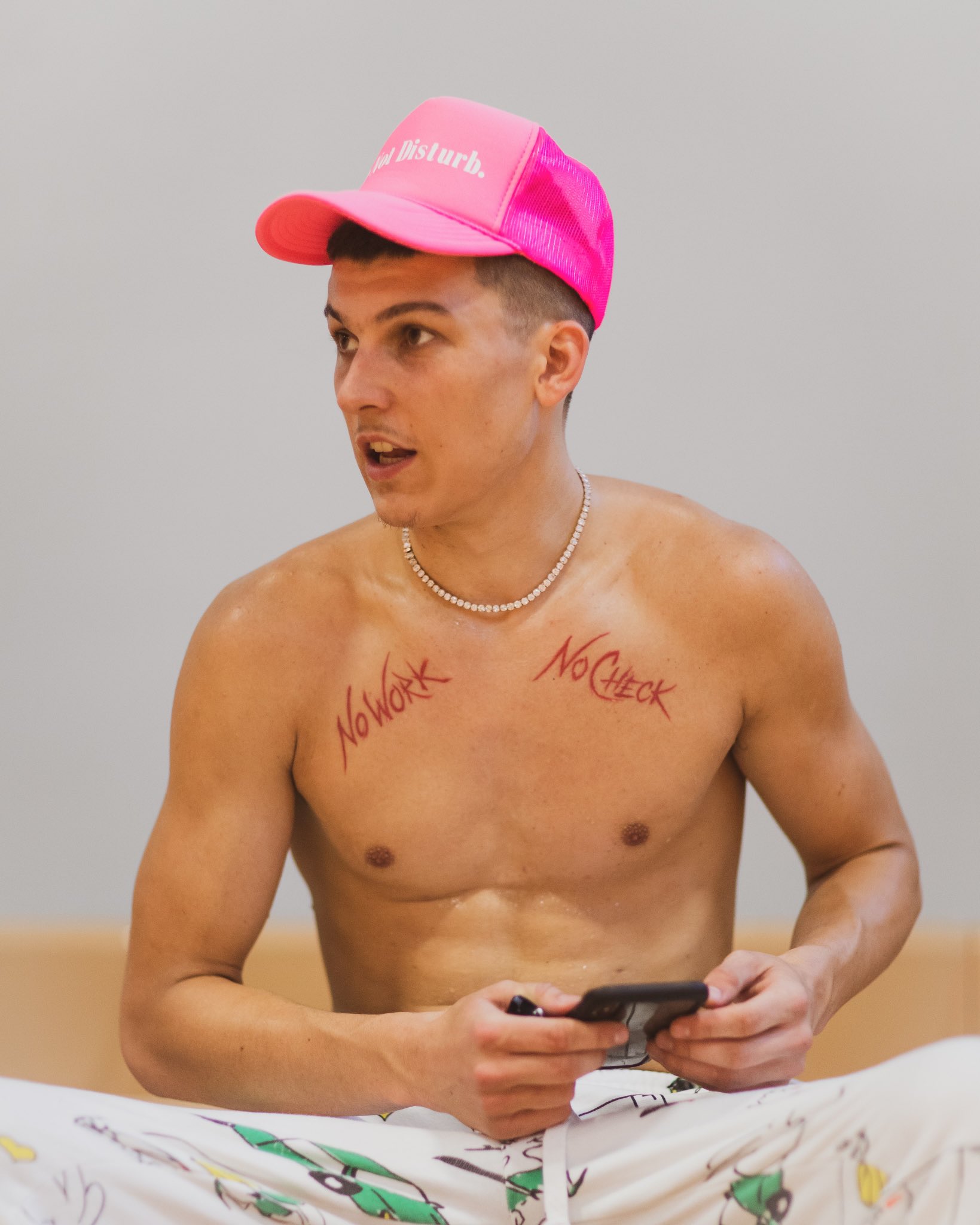 Tyler Herro tattoos: Tyler Herro's early No Work and No Check chest lettering