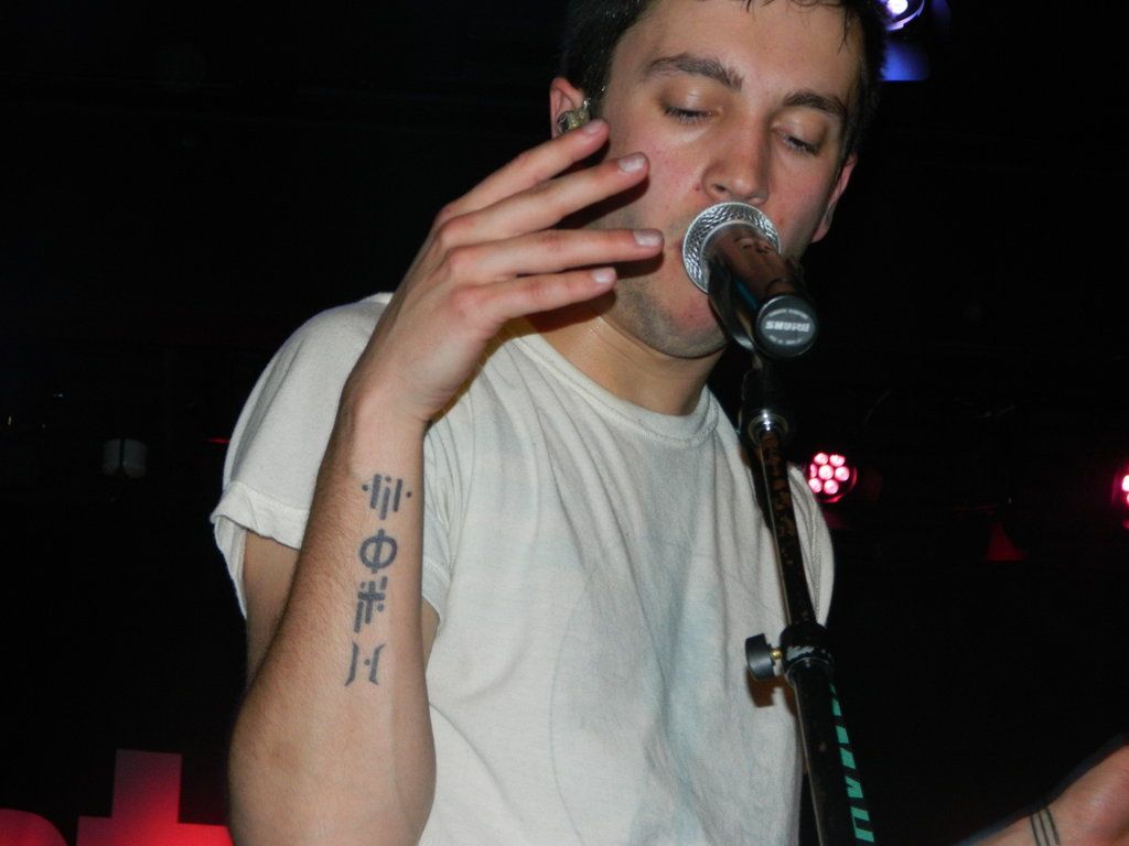 Tyler Joseph tattoos: right forearm symbol sequence