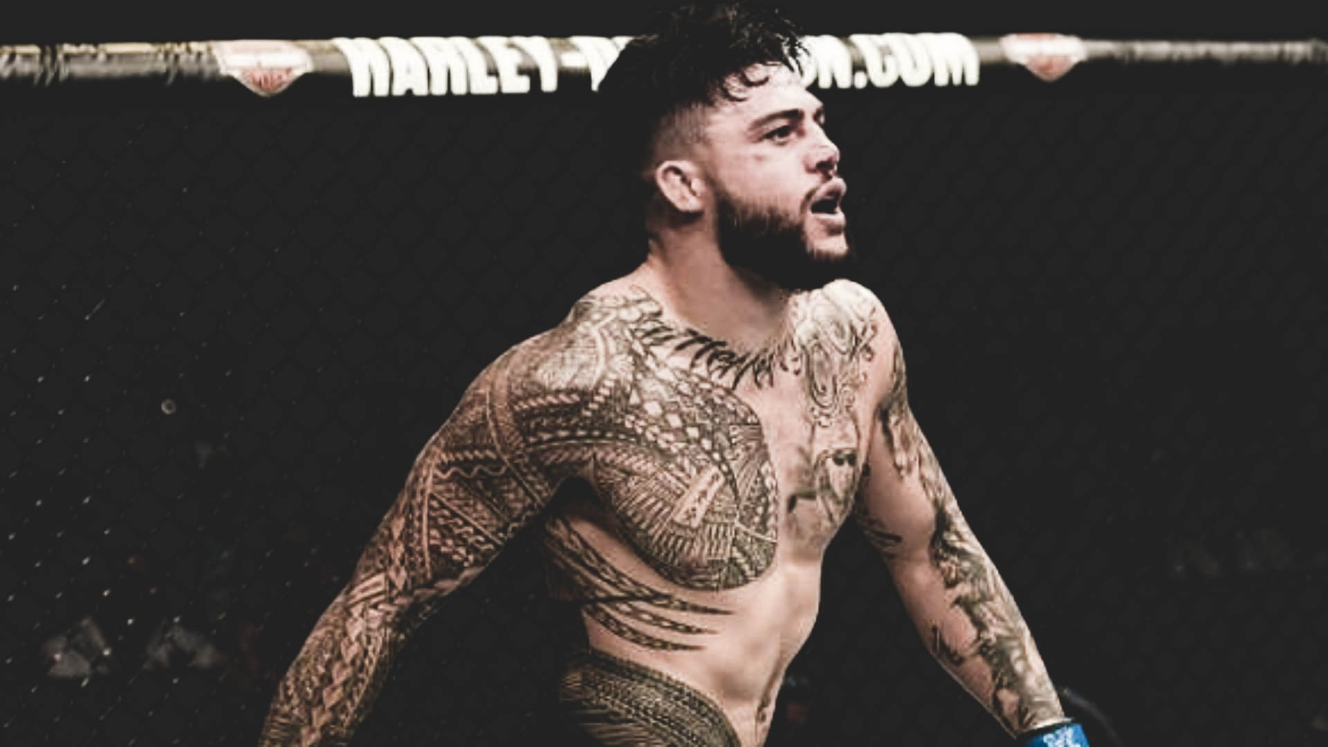 Tyson Pedro tattoos: Action photograph showing Pedro’s tattooed chest, shoulders and arms during competition.