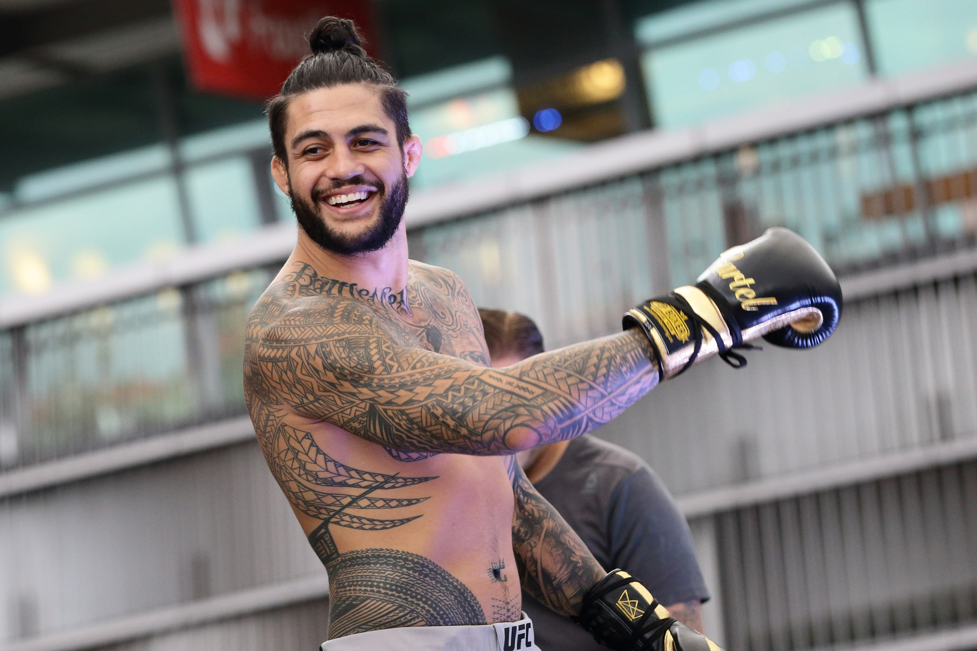 Tyson Pedro tattoos: Training photograph showing the geometric tatau wrapping across Pedro’s arm, side and torso.