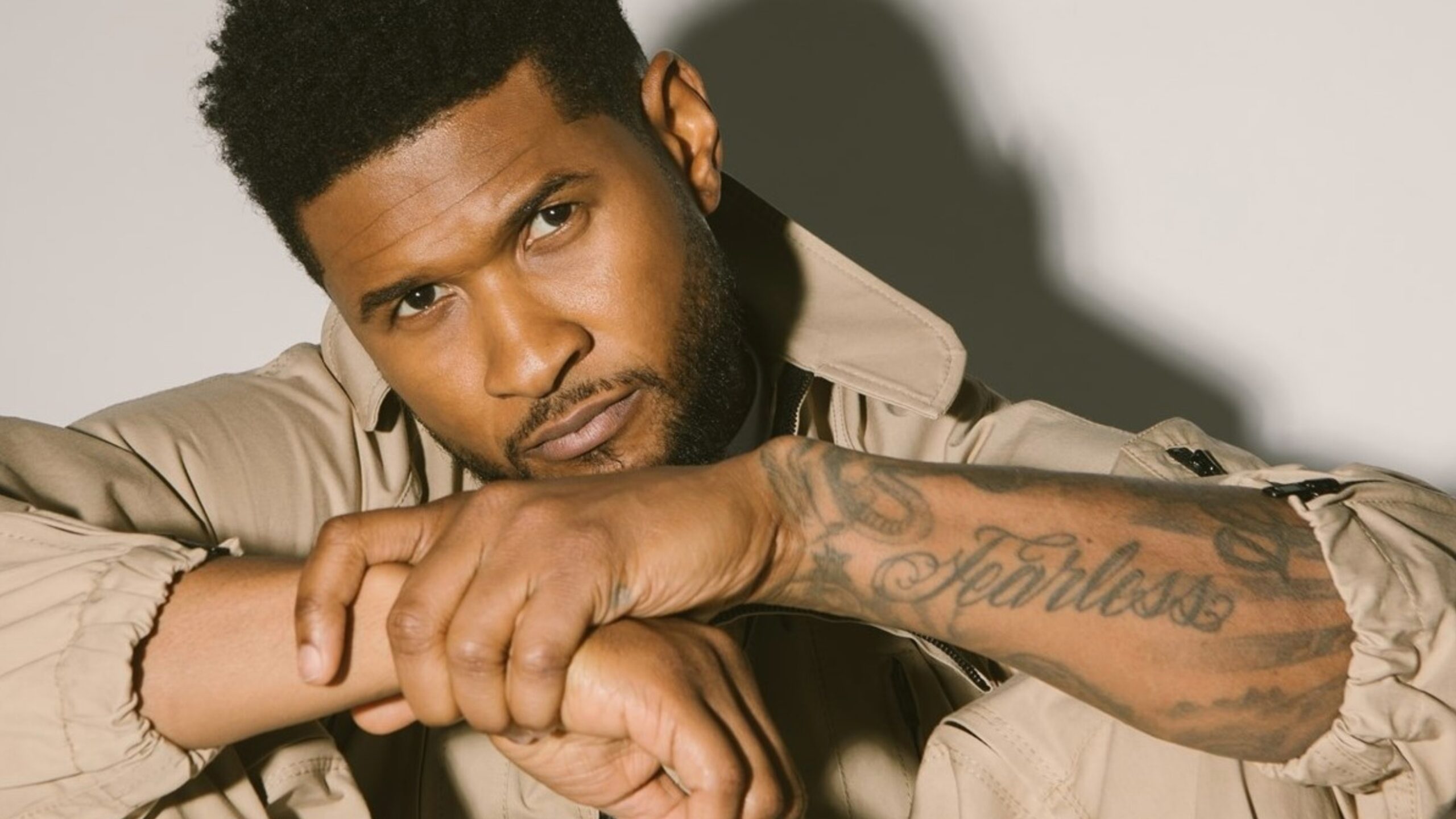 Usher Fearless forearm tattoo