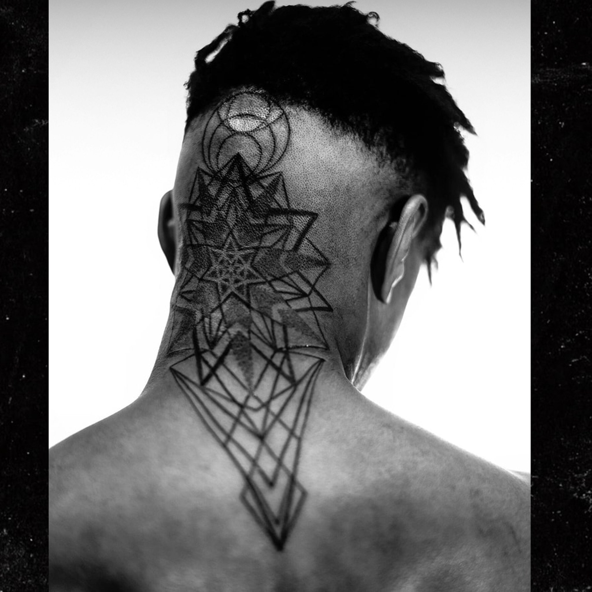 Usher geometric head and neck tattoo