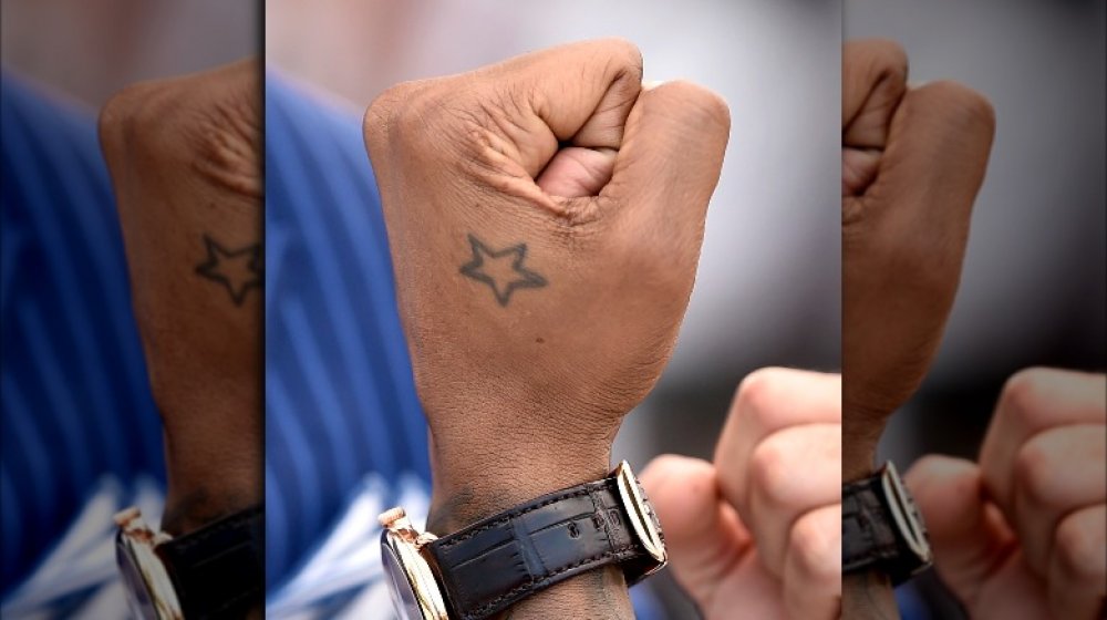 Usher star hand tattoo