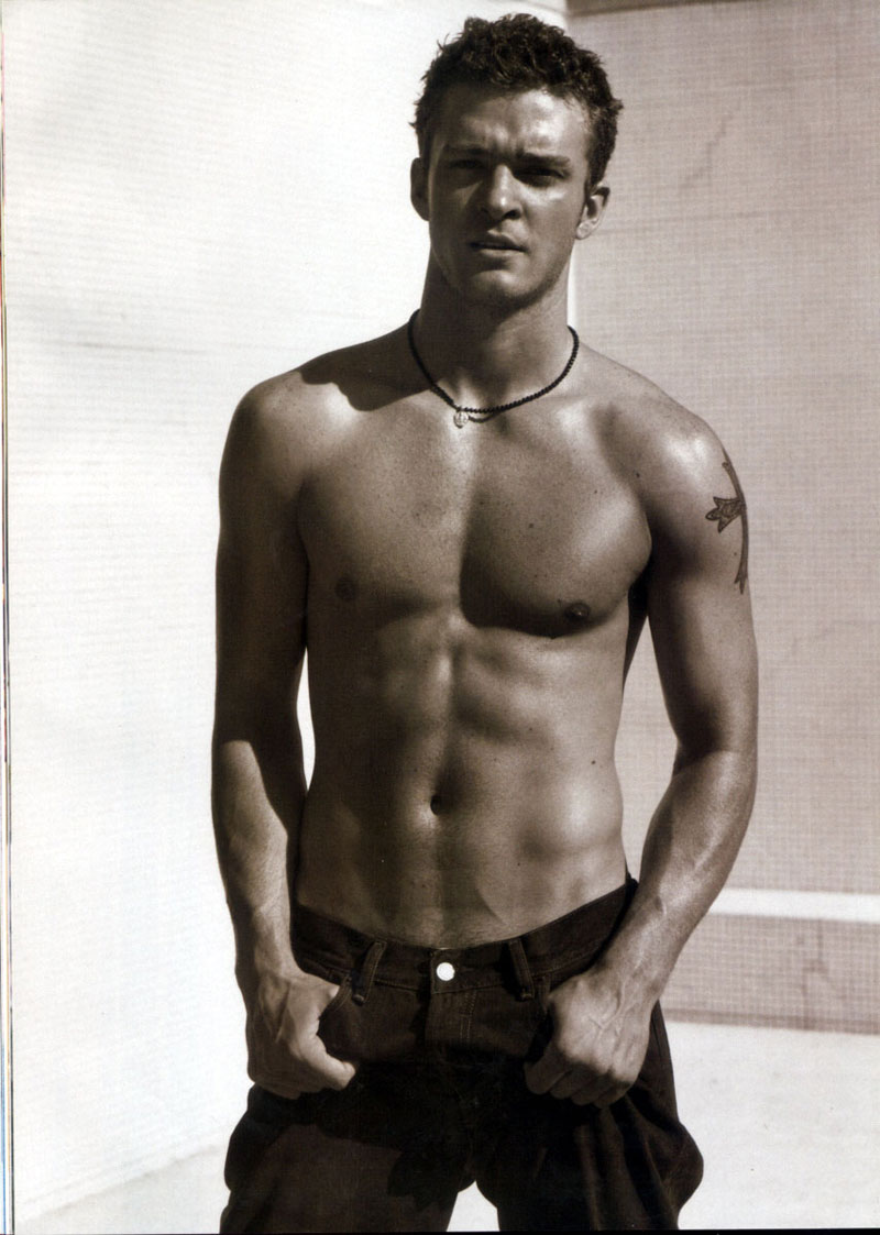 Justin Timberlake tattoos: early upper-arm star detail in a clear full-body tattoo photograph