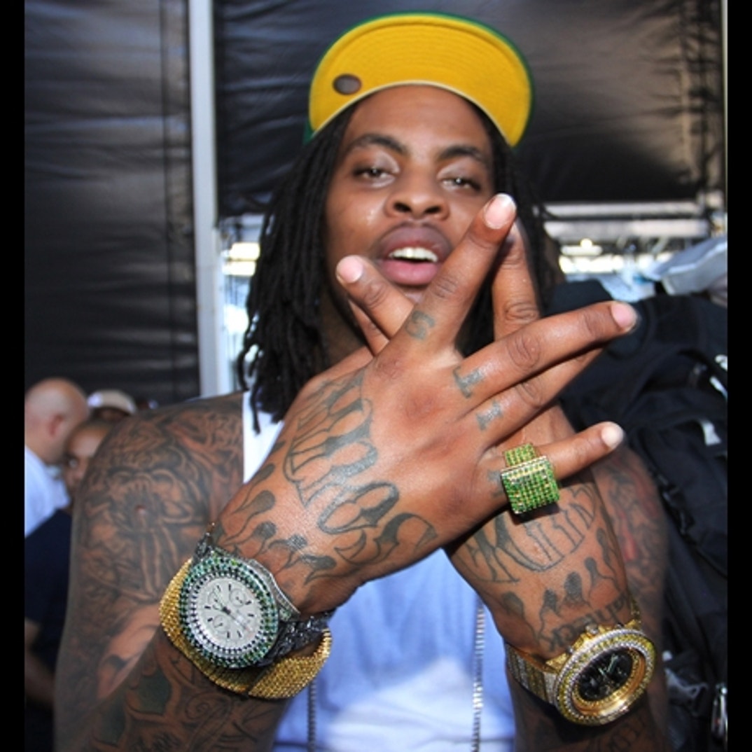 Waka Flocka Flame hand and arm tattoos