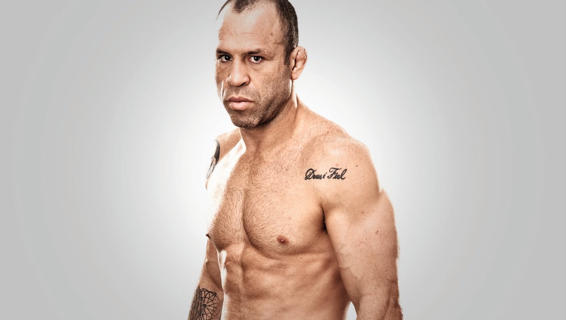 Wanderlei Silva tattoos: Deus é Fiel shoulder tattoo in a clean shirtless portrait