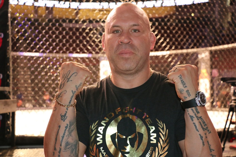 Wanderlei Silva tattoos: Layered arm lettering and symbols shown clearly at a fight event
