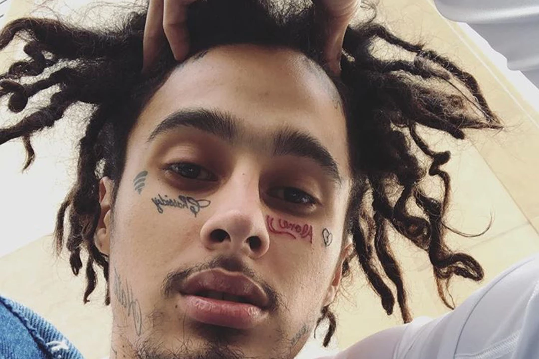 Wifisfuneral tattoos: the Alone lettering, broken heart and other close face tattoos