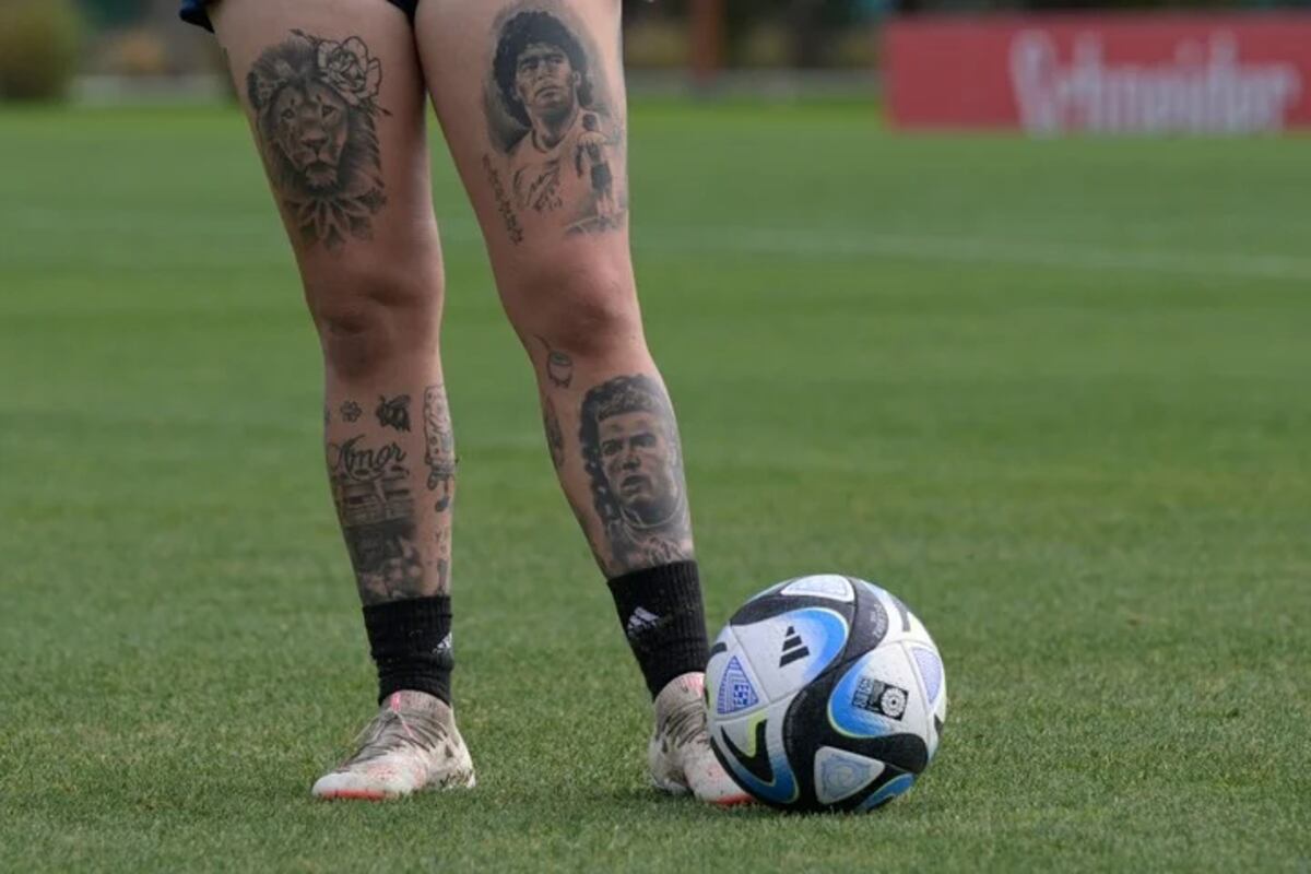 Yamila Rodriguez tattoos: Genuine single-subject training photograph with face and tattooed legs visible.