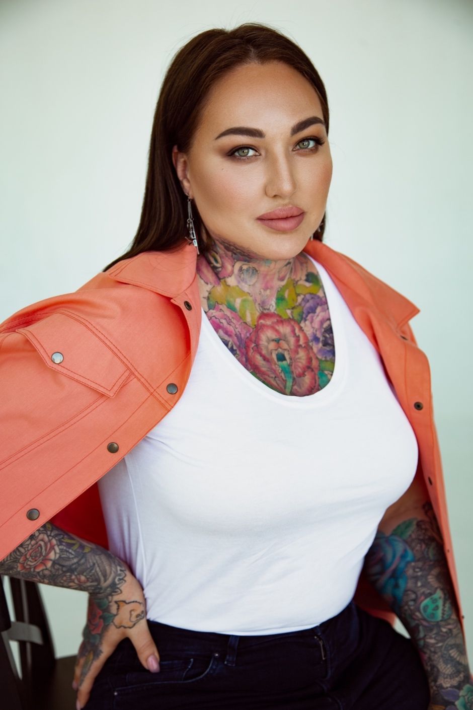 Yaroslava Naumenko tattoos: Documented colorful floral sleeves on the forearms and upper arms