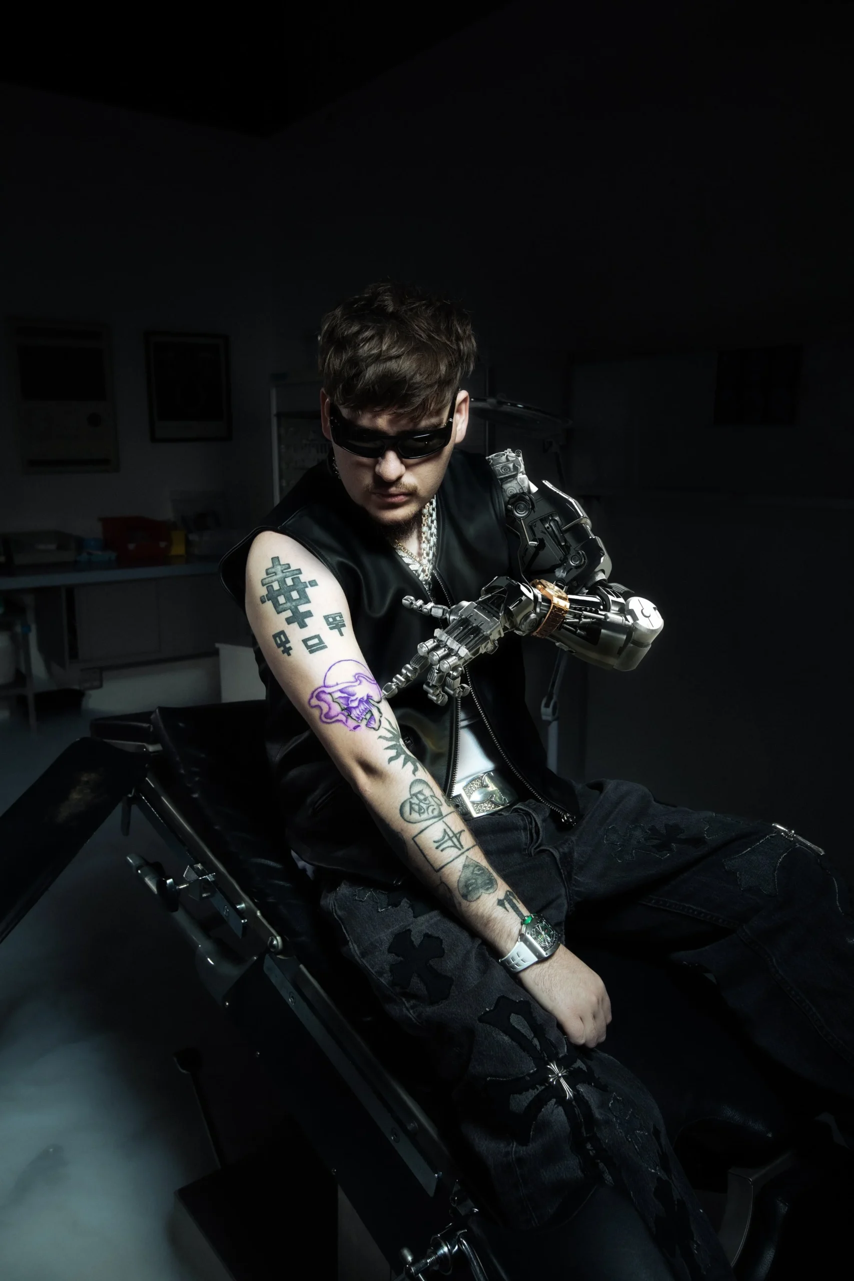 Yeat tattoos: upper arm blackwork and purple figure